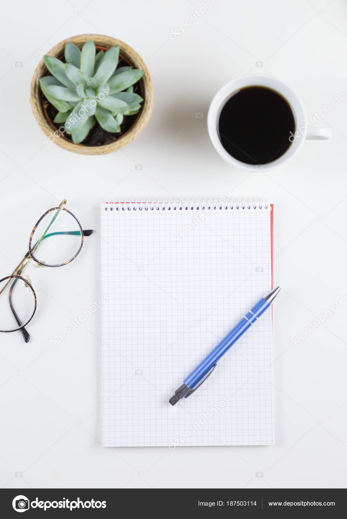 Neat White Desk Or Workstation With Potted Plant Stock Photo