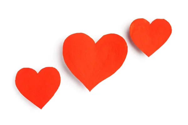 Süße rote Herzen liegen auf weißem Hintergrund. — Stockfoto