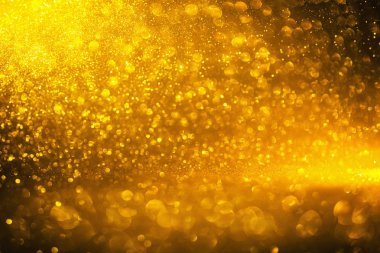 Altın glitter doku doğum günü, yıldönümü, düğün, yeni yıl arifesi ya da Noel için arka plan Derma bulanık.