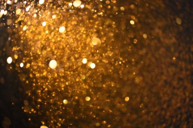Altın glitter doku doğum günü, yıldönümü, düğün, yeni yıl arifesi ya da Noel için arka plan Derma bulanık.