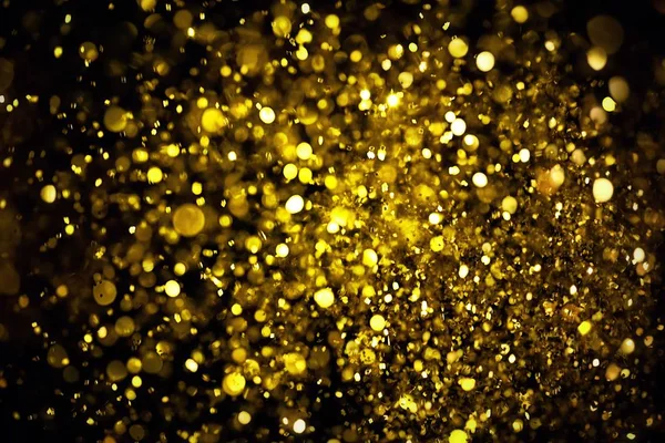 golden glitter texture Colorfull Blurred abstract background for birthday, anniversary, wedding, new year eve or Christmas.