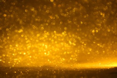 Altın glitter doku doğum günü, yıldönümü, düğün, yeni yıl arifesi ya da Noel için arka plan Derma bulanık.