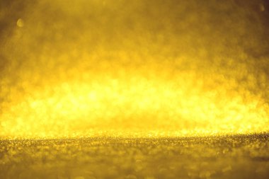 Altın glitter doku doğum günü, yıldönümü, düğün, yeni yıl arifesi ya da Noel için arka plan Derma bulanık.
