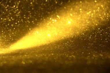 Altın glitter doku doğum günü, yıldönümü, düğün, yeni yıl arifesi ya da Noel için arka plan Derma bulanık.