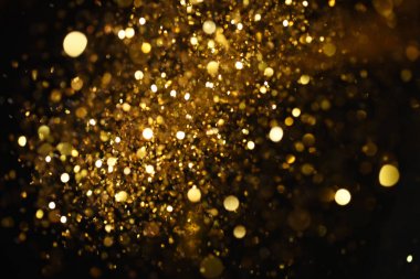 Altın glitter doku doğum günü, yıldönümü, düğün, yeni yıl arifesi ya da Noel için arka plan Derma bulanık.