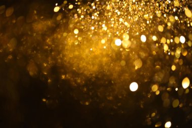 Altın glitter doku doğum günü, yıldönümü, düğün, yeni yıl arifesi ya da Noel için arka plan Derma bulanık.