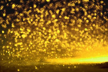 Altın glitter doku doğum günü, yıldönümü, düğün, yeni yıl arifesi ya da Noel için arka plan Derma bulanık.