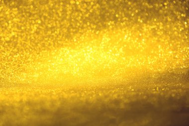 Altın glitter doku doğum günü, yıldönümü, düğün, yeni yıl arifesi ya da Noel için arka plan Derma bulanık.