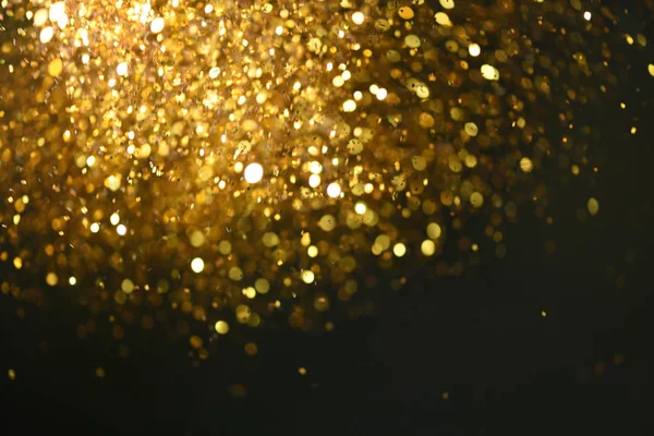 Altın glitter doku doğum günü, yıldönümü, düğün, yeni yıl arifesi ya da Noel için arka plan Derma bulanık.