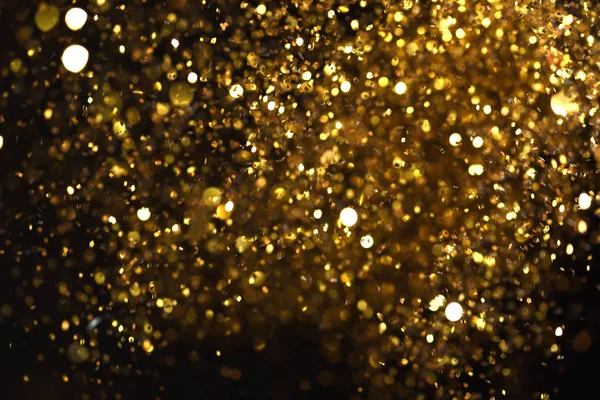 golden glitter texture Colorfull Blurred abstract background for birthday, anniversary, wedding, new year eve or Christmas.