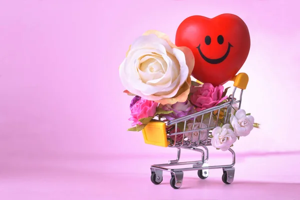 Love and happy Valentine's day roses colorful and red heart symbol in shopping cart.