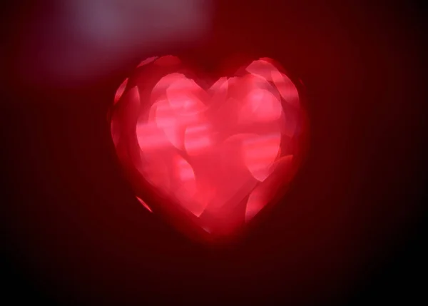 Kalp Şeklinde Kırmızı Bulanıklık Ligth Bokeh Siyah Bir Zemin Üzerine — Stok fotoğraf