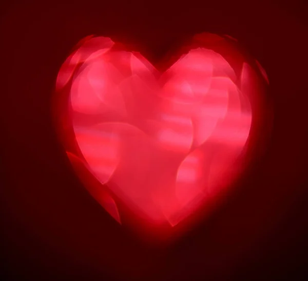 Red Blur Coração Forma Ligth Bokeh Fundo Preto — Fotografia de Stock