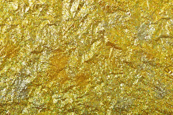 Altın glitter doku doğum günü, yıldönümü, düğün, yeni yıl arifesi ya da Noel için arka plan Derma bulanık.