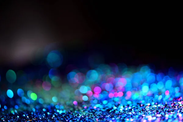 Altın glitter doku doğum günü, yıldönümü, düğün, yeni yıl arifesi ya da Noel için arka plan Derma bulanık.