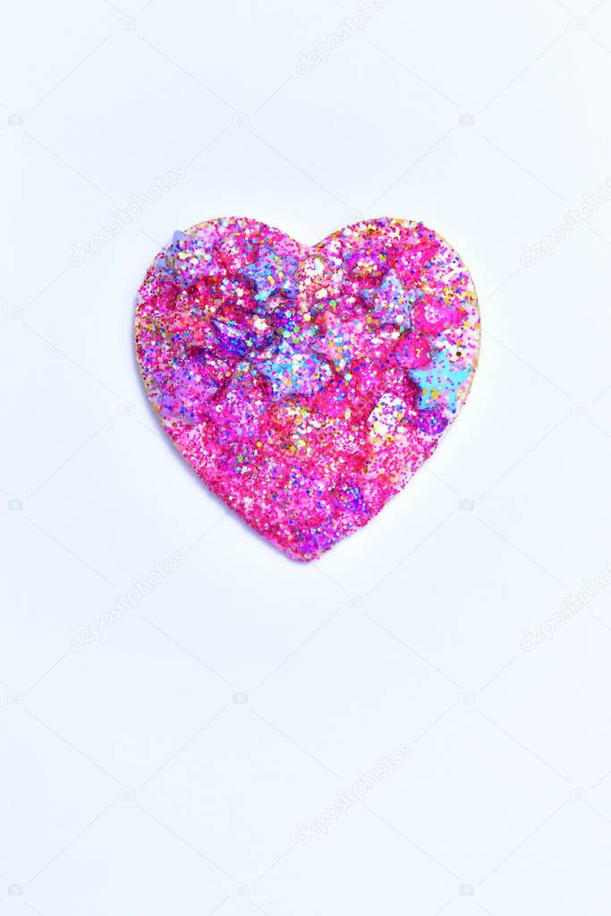 Heart glitter and star on white background.