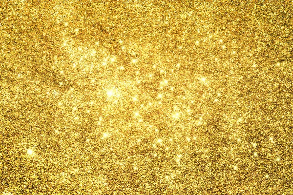Altın glitter doku doğum günü, yıldönümü, düğün, yeni yıl arifesi ya da Noel için arka plan Derma bulanık.
