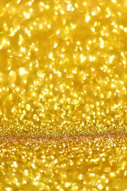 Altın glitter doku doğum günü, yıldönümü, düğün, yeni yıl arifesi ya da Noel için arka plan Derma bulanık.