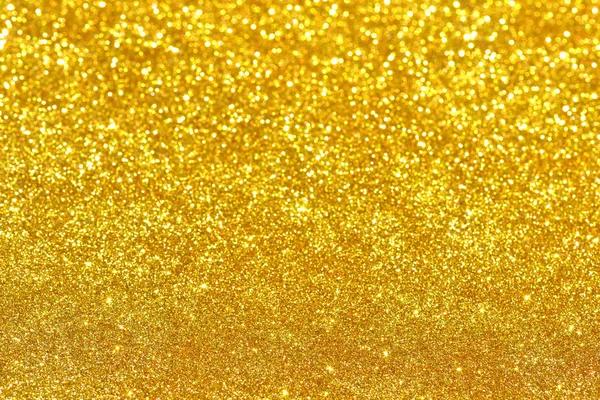 Altın glitter doku doğum günü, yıldönümü, düğün, yeni yıl arifesi ya da Noel için arka plan Derma bulanık.