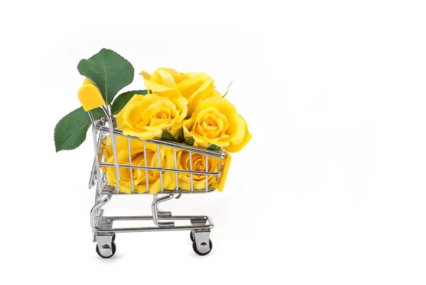 yellow roses in shopping cart on a white background