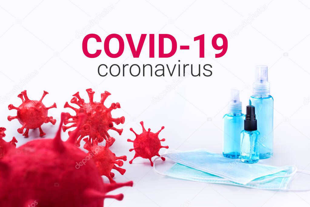 Coronavirus (COVID-19) that Built by molding clay painted has surgical masks and alcohol hand sanitizer gel for hygiene spread protection.