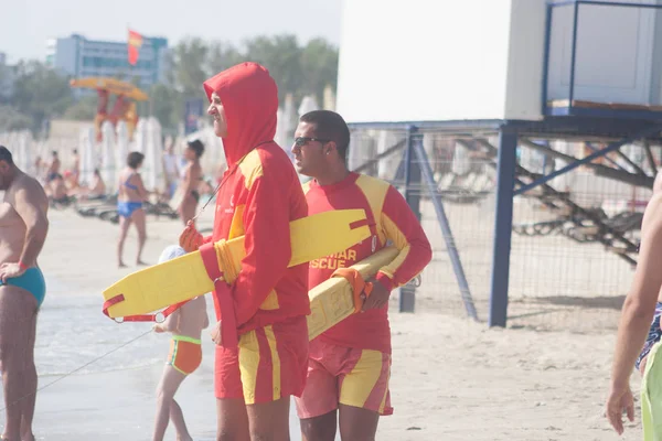 CONSTANTA, ROMANIA - AUGUST 21, 2010. lifeguards on the beach — Stock Photo, Image