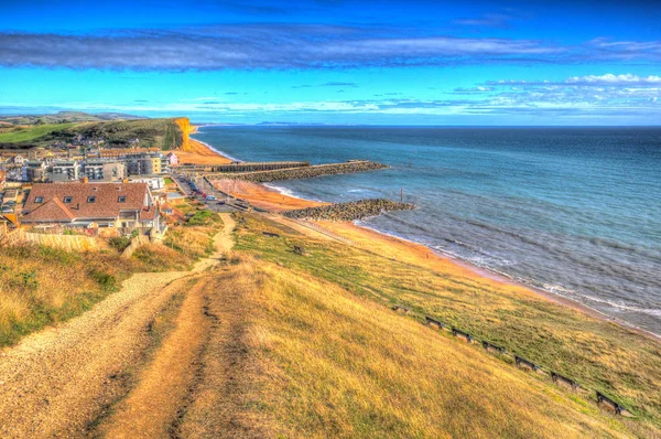 Coast path West Bay Dorset uk in colourful hdr view to east of the Jurassic coast on a beautiful summer day with blue sky and sea — Stock Photo, Image