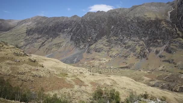 Glencoe Scotland UK stunning elevated view of famous Scottish glen mountains and distant traffic — Stock Video