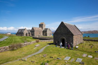 Iona Abbey Scotland uk on the Scottish island off the Isle of Mull west coast of Scotland a popular tourist destination  clipart