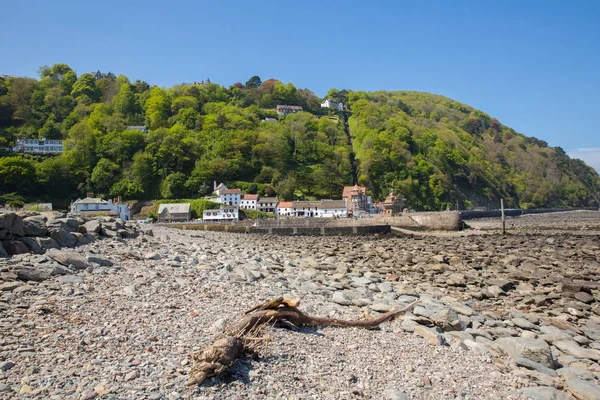 Lynmouth beach and harbour Devon England UK with hillside railway in the trees in beautiful spring sunshine — Stock Photo, Image