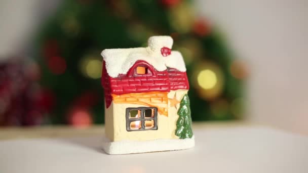 Christmas Toy House Candle Beautiful Snow Covered House Fire Windows — Stock Video