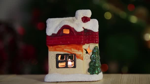 Christmas Toy House Candle Beautiful Snow Covered House Fire Windows — Stock Video