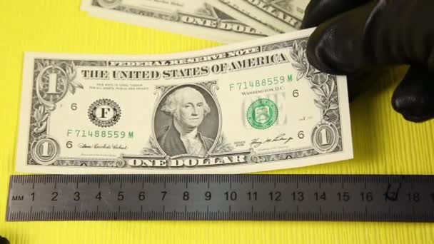 Criminal Gloves Dollars Counterfeiters Measure Counterfeit Money Bills Ruler Yellow — Stock Video