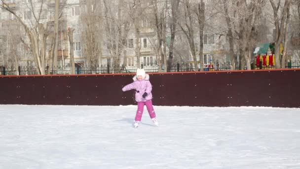 Little Girl Laughs Skates Ice Girl Winter Clothes Alone Rides — Stock Video