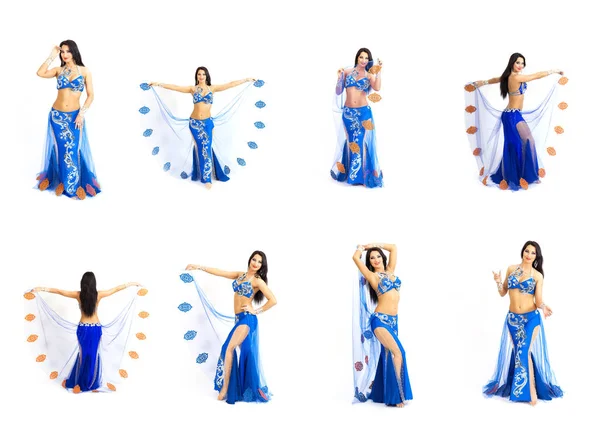 Une jeune danseuse vêtue de bleu exécute une danse orientale du ventre. Isoler . — Photo