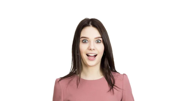 Förvånad ansikte av en ung flicka på en vit bakgrund. — Stockfoto