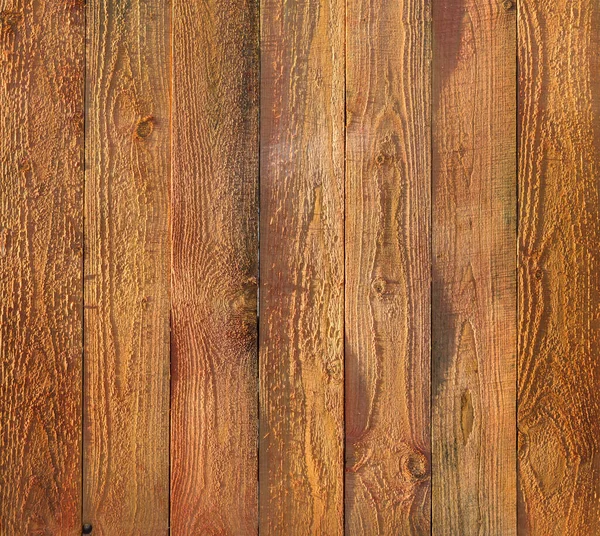 Raw wooden surface timber texture fence panel planks background in the sunlight