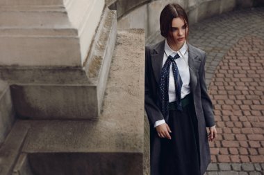 Woman In Fashion Clothes Posing In Street