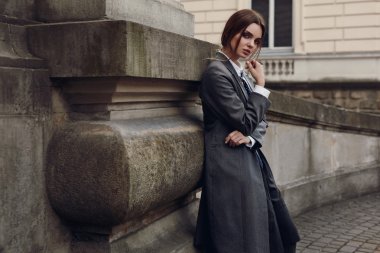 Woman In Fashion Clothes Posing In Street