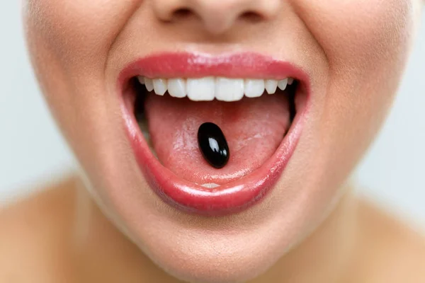 Beautiful Woman Mouth With Pill On Tongue. Girl Taking Medicine — Stock Photo, Image