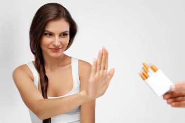 Closeup Of Woman Giving Up Smoking Cigarettes. Health Concept clipart