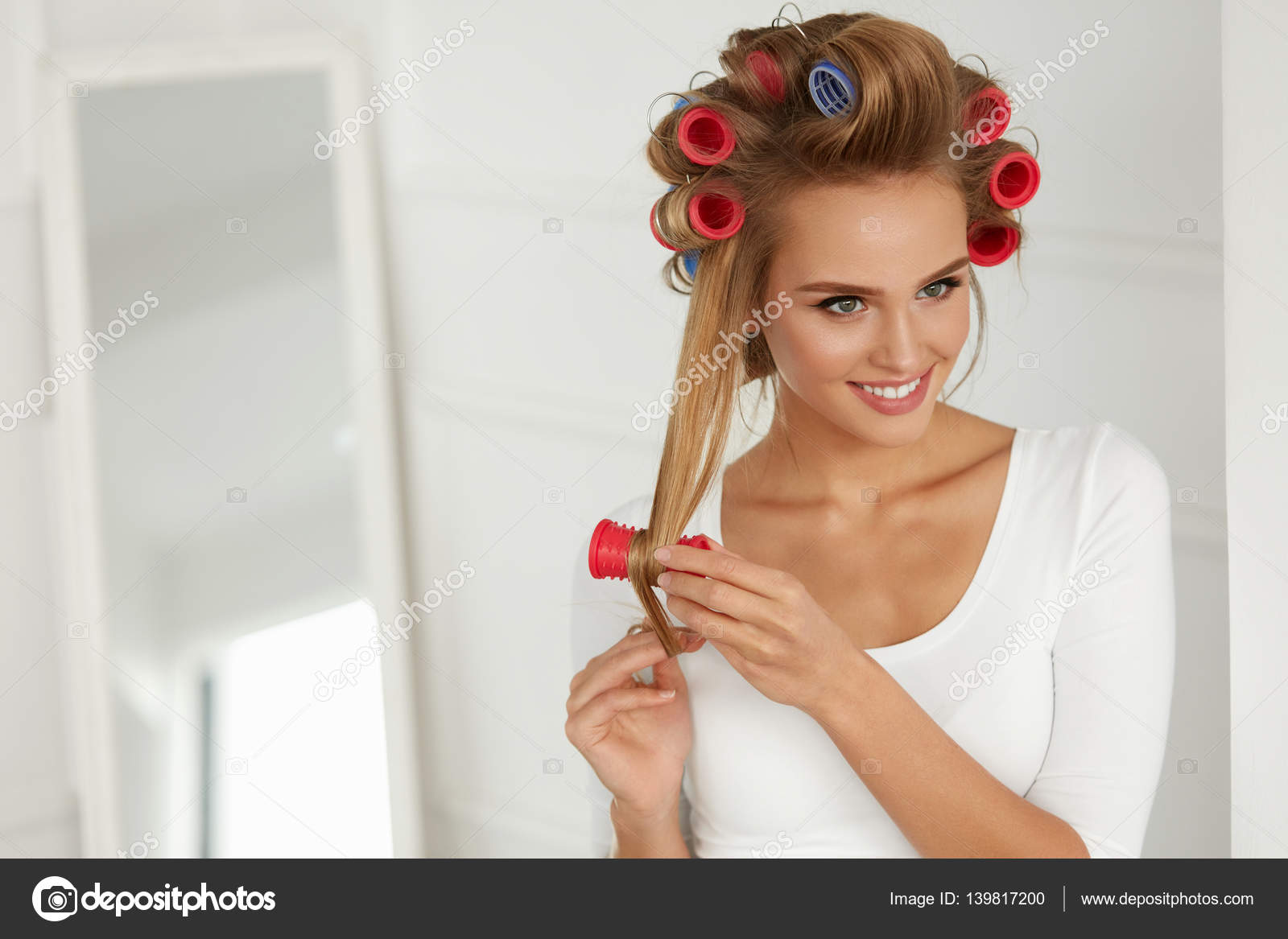 Beautiful Woman With Hair Curlers, Hair Rollers On Healthy Curly Stock  Photo by ©puhhha 139817200