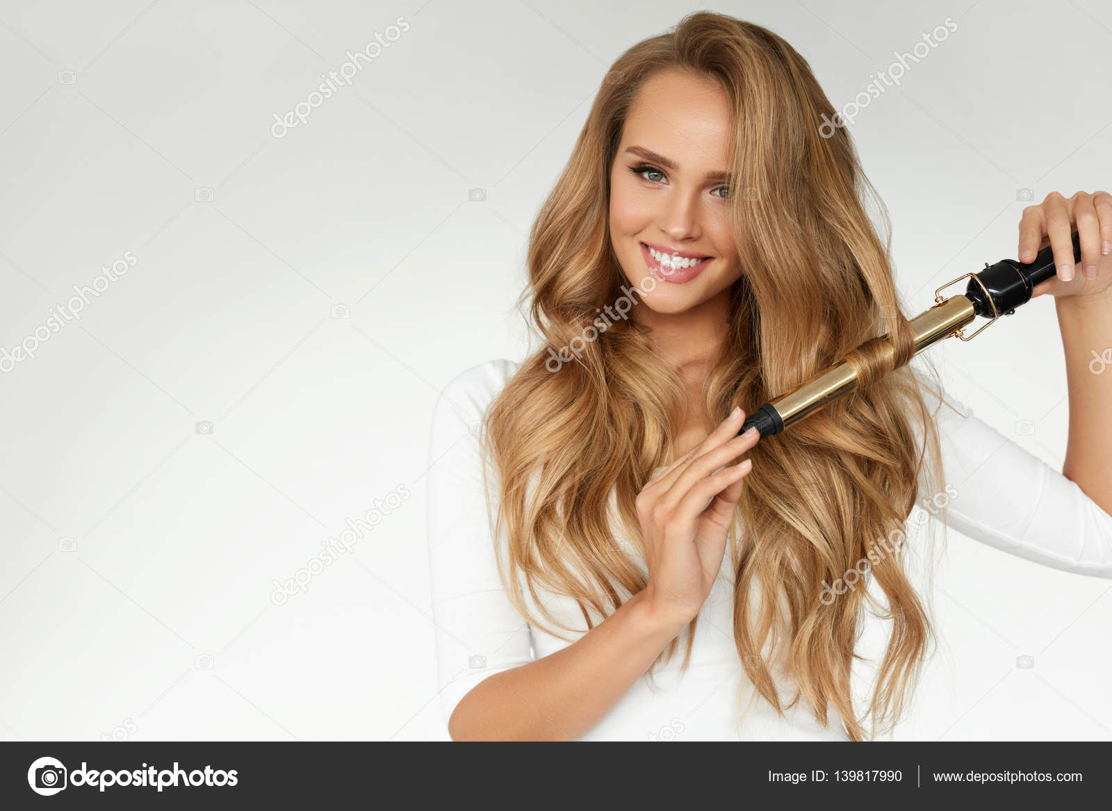 Curly Hair. Beautiful Woman Curling Long Wavy Hair With Iron Stock Photo by ©puhhha 139817990 Curly Hair. Beautiful Woman Curling Long Wavy Hair With Iron Stock Photo by ©puhhha 139817990