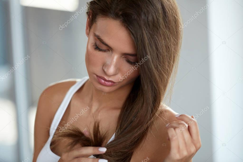 Beautiful Woman With Split Ended Hair. Health And Beauty Concept