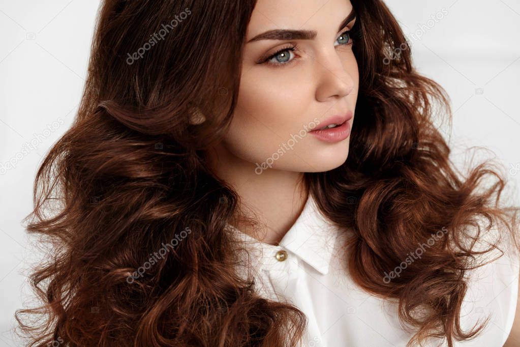 Beautiful Girl Model With Wavy Curly Hairstyle. Brown Hair Color