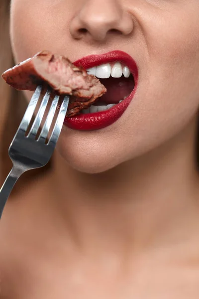 Woman Mouth Biting Meat. Beautiful Female Mouth Eating Meat