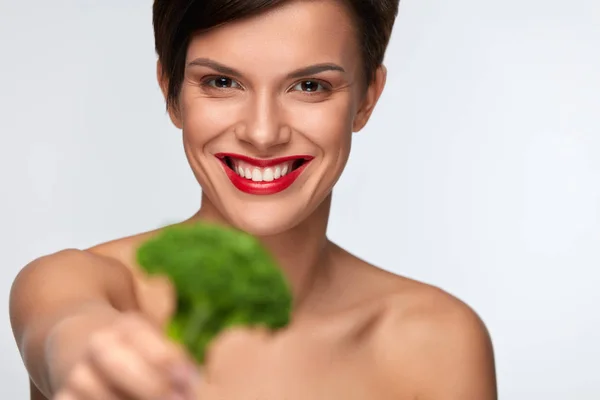 Healthy Foods. Beautiful Woman Holding Organic Green Broccoli