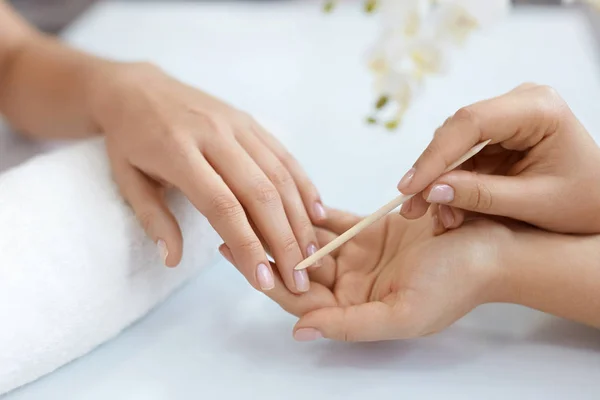 Nail Salon. Closeup Of Female Hands With Wooden Stick. Manicure — Stock Photo, Image