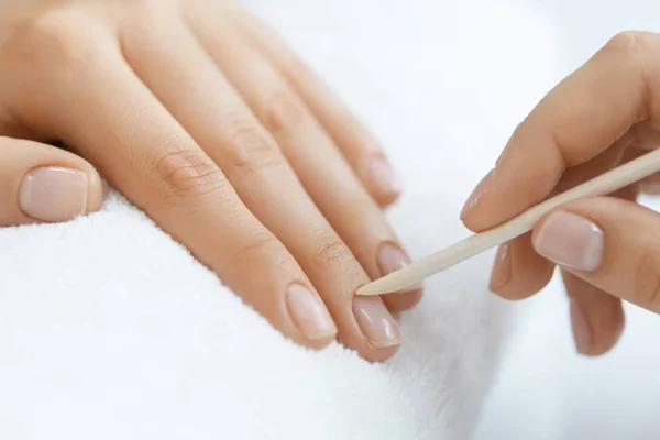Beautician Removing Cuticle On Woman Hands With Wooden Stick — Stock Photo, Image