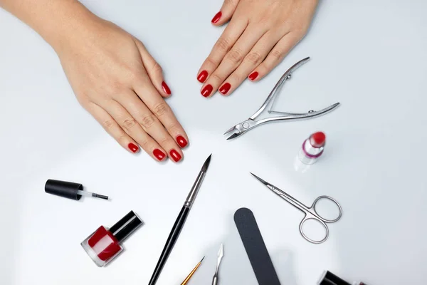 Hands Care. Beautiful Female Hands With Red Polish And Tools